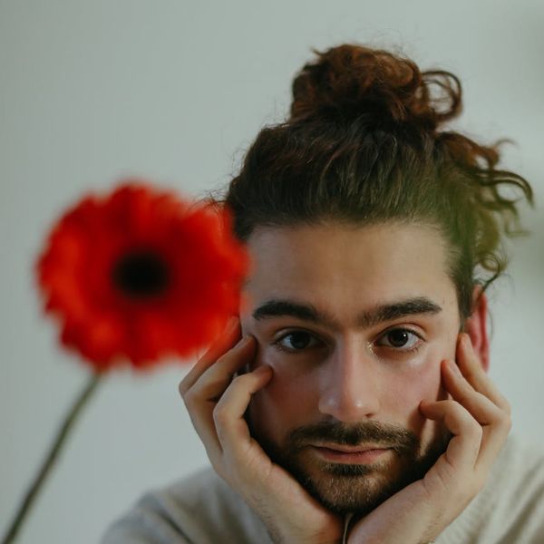 Man in a meditative state after a workout, looking focused and calm.