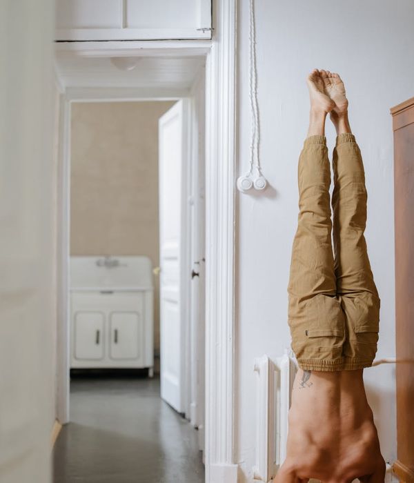 Man performing a controlled strength exercise in a calm environment.